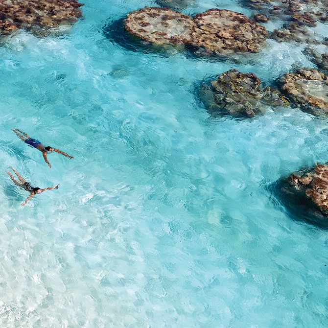 Couple Swimming in Coral Reef at The Brando Resort - Australia, New Zealand, and Tahiti