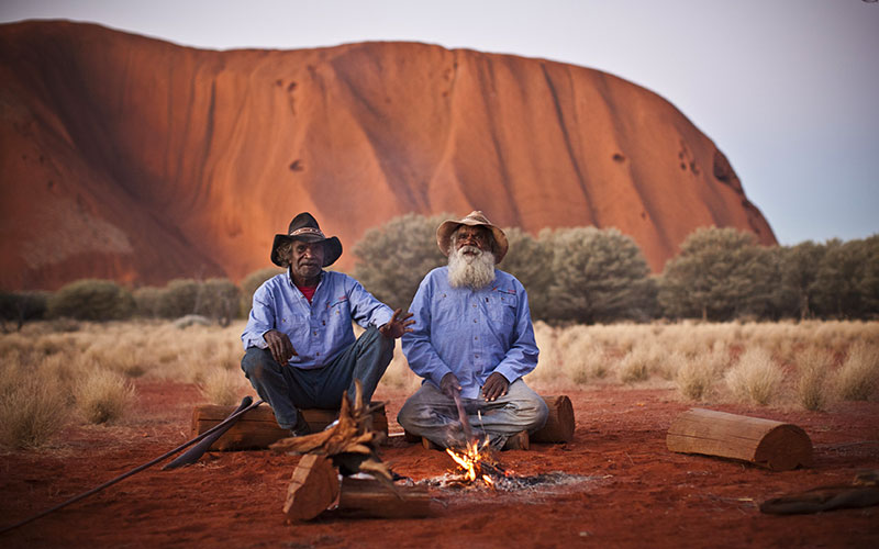 Aboriginal guides having a campfire at Uluru