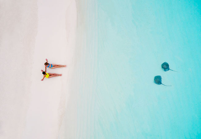 Aerial Shot of Two Women on the Beach - Best Things to Do in French Polynesia