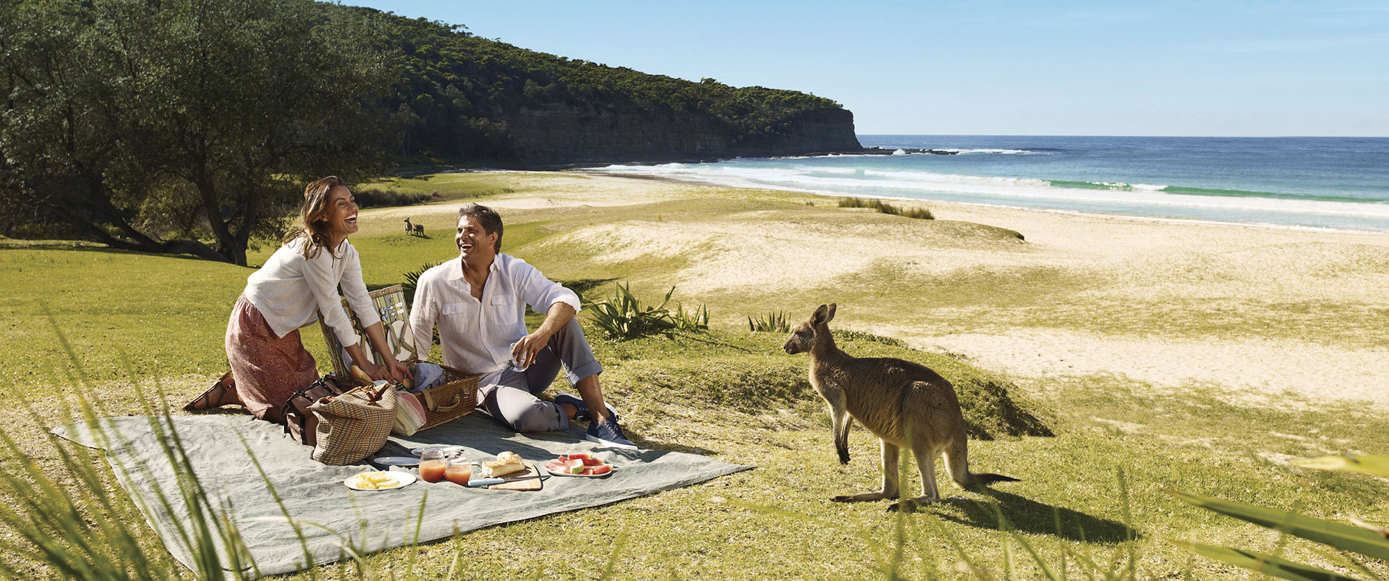 best multi destination travel packages - Pebbly beach couple - Kangaroo beach