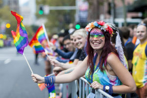 Woman Holding a Rainbow LGBT+ Pride Flag at the Sydney Gay and Lesbian Mardi Gras Parade